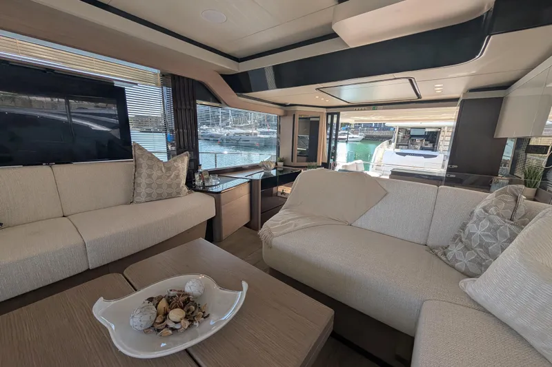 In Stock Yacht Photos Pics Luxurious interior of 2025 Absolute Navetta 53 yacht with elegant seating and decor.