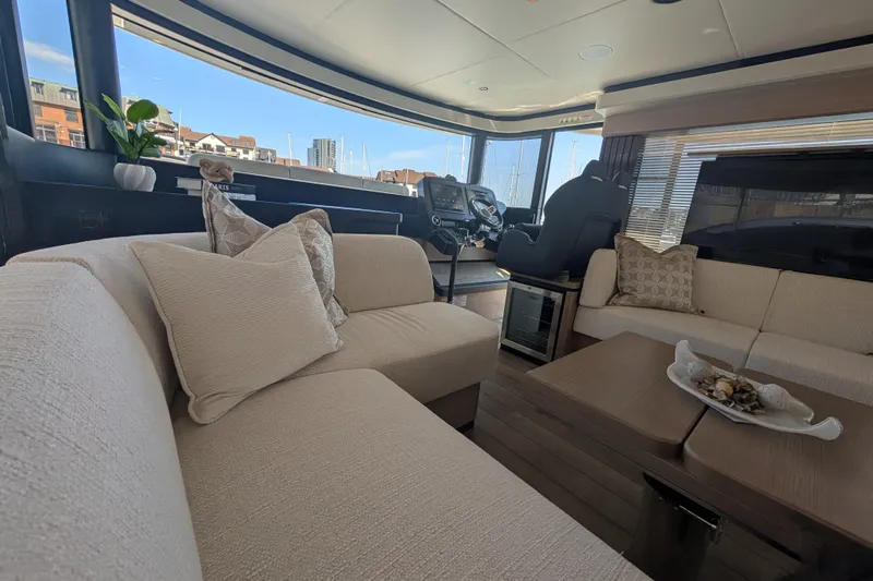 In Stock Yacht Photos Pics Luxurious interior of 2025 Absolute Navetta 53 yacht with elegant seating and modern decor.