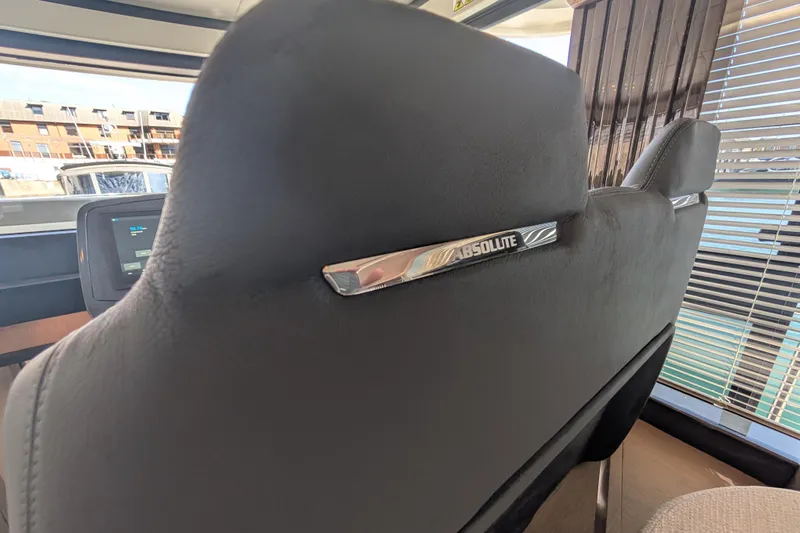 In Stock Yacht Photos Pics Interior view of 2025 Absolute Navetta 53 yacht, featuring luxurious seating and modern design.