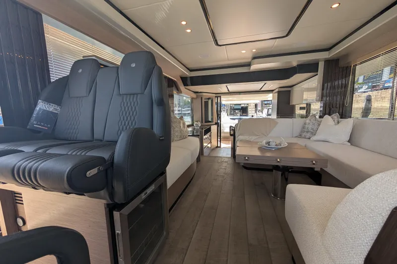 In Stock Yacht Photos Pics Luxurious interior of 2025 Absolute Navetta 53 yacht with modern seating and elegant decor.
