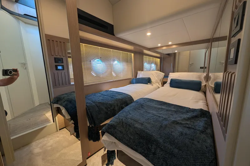 In Stock Yacht Photos Pics Luxurious twin bedroom in 2025 Absolute Navetta 53 yacht, featuring modern design and cozy ambiance.