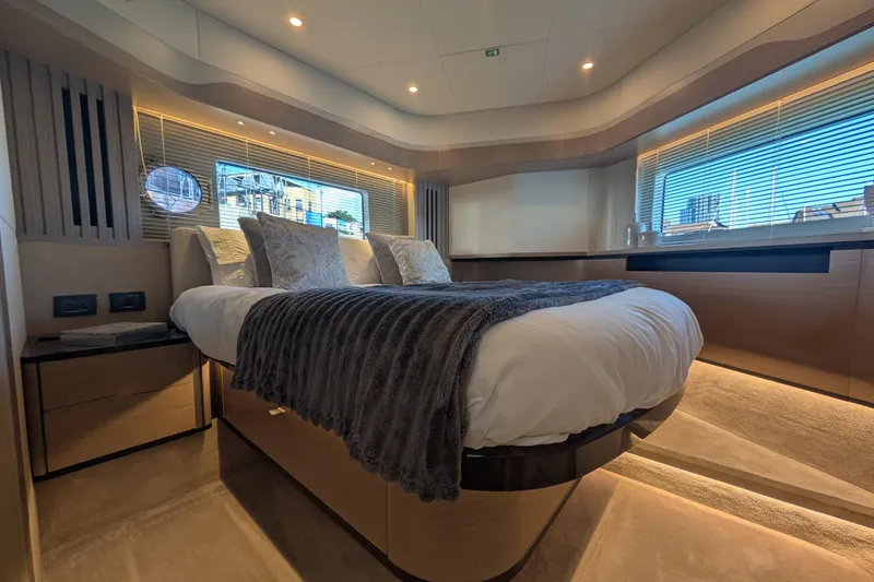 In Stock Yacht Photos Pics Luxurious bedroom interior of 2025 Absolute Navetta 53 yacht with modern design and cozy ambiance.
