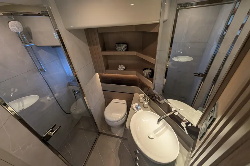 In Stock Yacht Photos Pics Luxurious bathroom in 2025 Absolute Navetta 53 yacht with modern fixtures and elegant design.