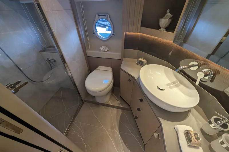 In Stock Yacht Photos Pics Luxurious bathroom in 2025 Absolute Navetta 53 yacht with modern fixtures and elegant design.