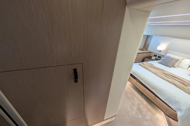 In Stock Yacht Photos Pics Luxurious bedroom interior of 2025 Absolute Navetta 53 yacht, featuring modern design and cozy ambiance.