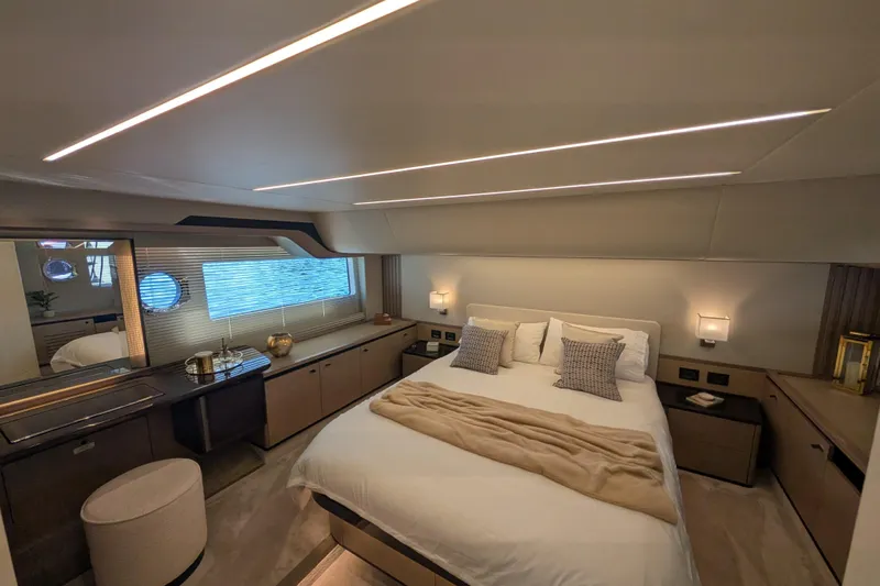 In Stock Yacht Photos Pics Luxurious bedroom interior of 2025 Absolute Navetta 53 yacht, featuring modern design and ambient lighting.