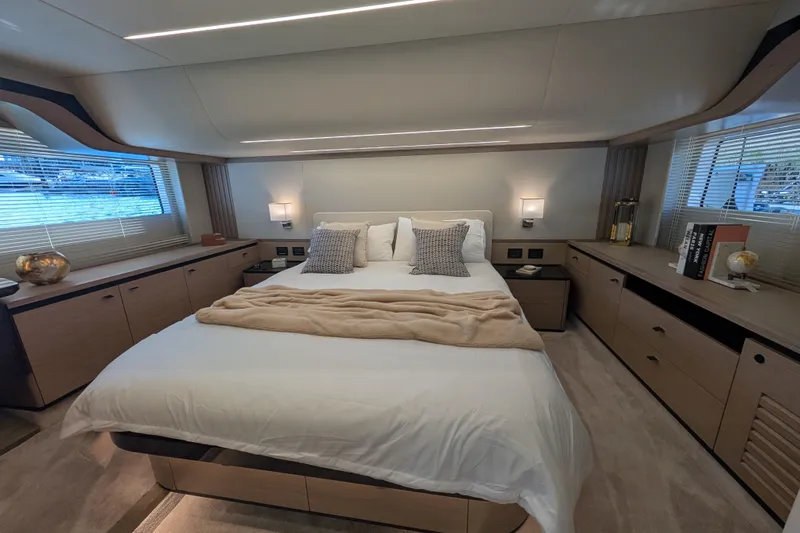 In Stock Yacht Photos Pics Luxurious bedroom interior of 2025 Absolute Navetta 53 yacht with modern design and cozy bedding.