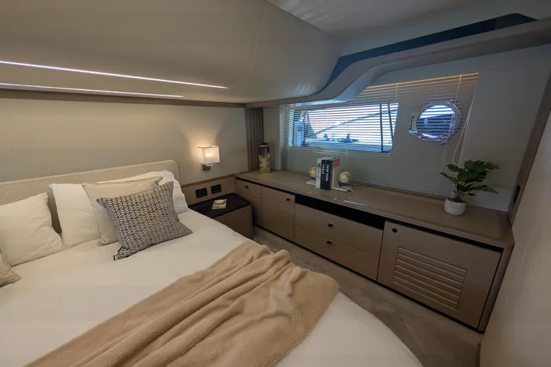In Stock Yacht Photos Pics Luxurious bedroom interior of 2025 Absolute Navetta 53 yacht, featuring elegant decor and modern furnishings.