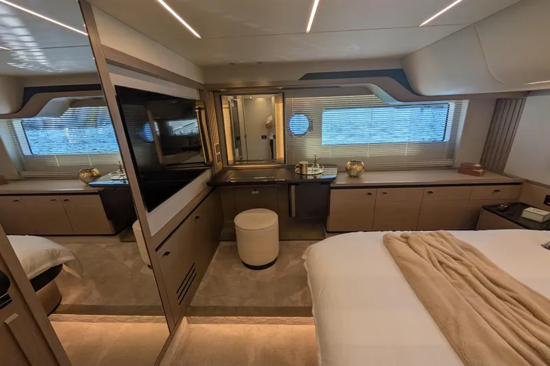 In Stock Yacht Photos Pics Luxurious interior of 2025 Absolute Navetta 53 yacht, featuring elegant bedroom and modern design.