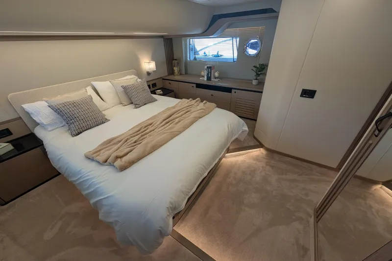 In Stock Yacht Photos Pics Luxurious bedroom interior of 2025 Absolute Navetta 53 yacht, featuring elegant design and cozy ambiance.