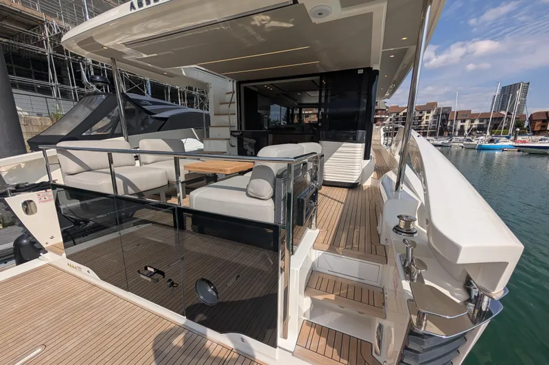 In Stock Yacht Photos Pics Luxurious 2025 Absolute Navetta 53 yacht with spacious deck and elegant seating area.