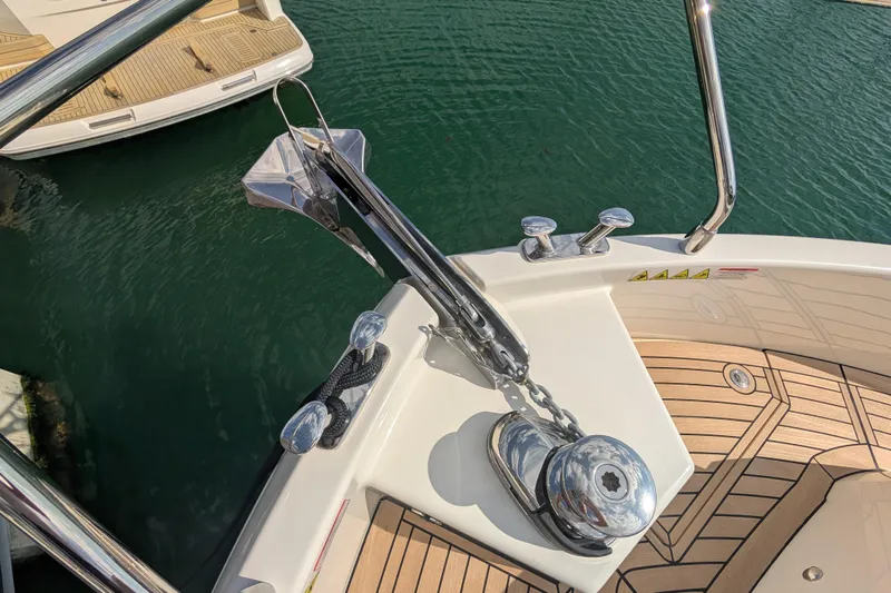 In Stock Yacht Photos Pics 2025 Absolute Navetta 53 yacht anchor and deck detail in marina setting.