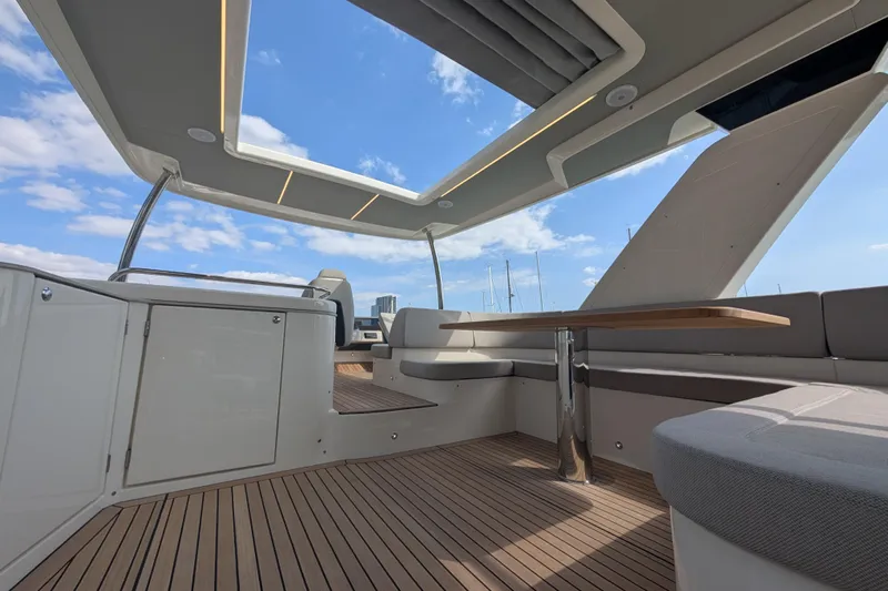 In Stock Yacht Photos Pics Luxurious interior of 2025 Absolute Navetta 53 yacht with modern design and open sky view.