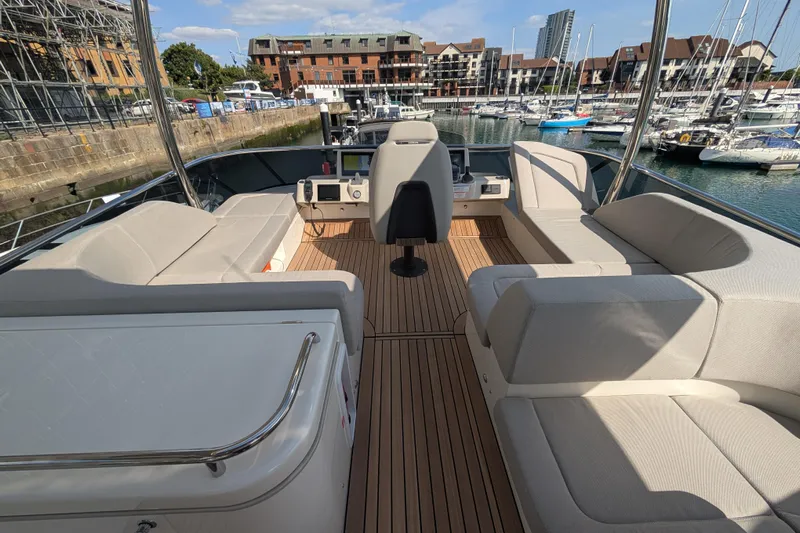 In Stock Yacht Photos Pics Luxurious 2025 Absolute Navetta 53 yacht interior with spacious seating and modern helm.