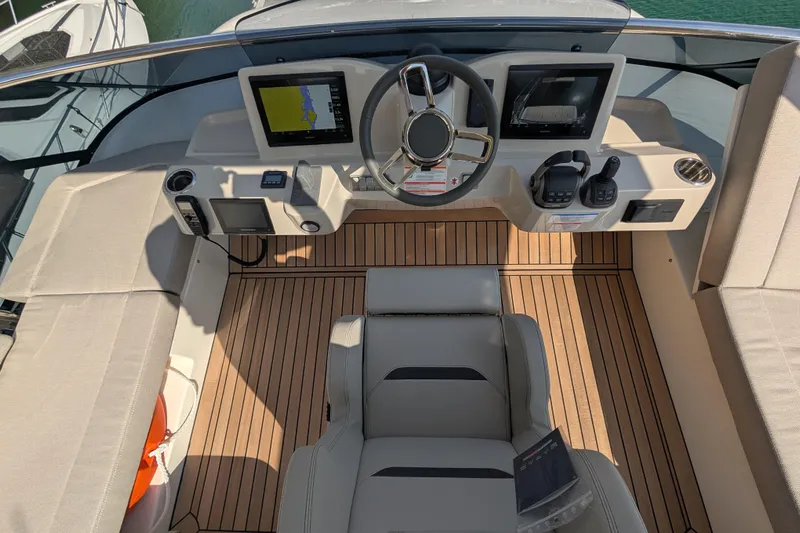 In Stock Yacht Photos Pics 2025 Absolute Navetta 53 yacht helm with modern controls and navigation screens.