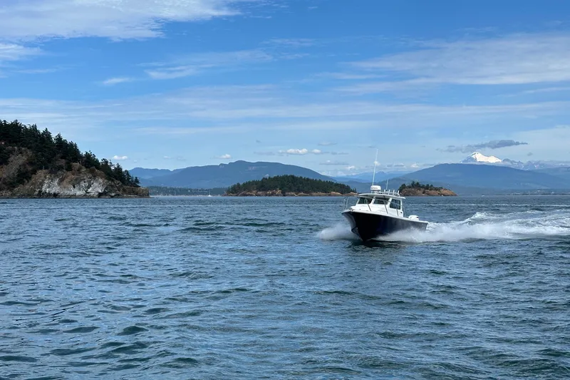  Yacht Photos Pics Parker 227 Explorer boat cruising on scenic waters, 2026 model.