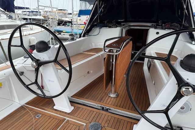 2017 Dehler 38 yacht cockpit with dual steering wheels and teak flooring.