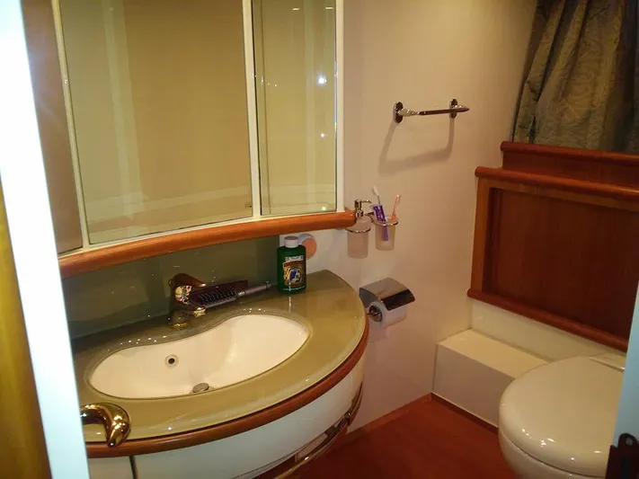  Yacht Photos Pics Bathroom interior of 2009 Azimut 62 Evolution yacht, featuring sink and toilet.