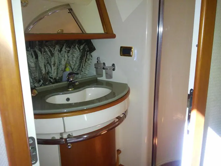  Yacht Photos Pics Luxurious bathroom interior of 2009 Azimut 62 Evolution yacht with modern sink and fixtures.