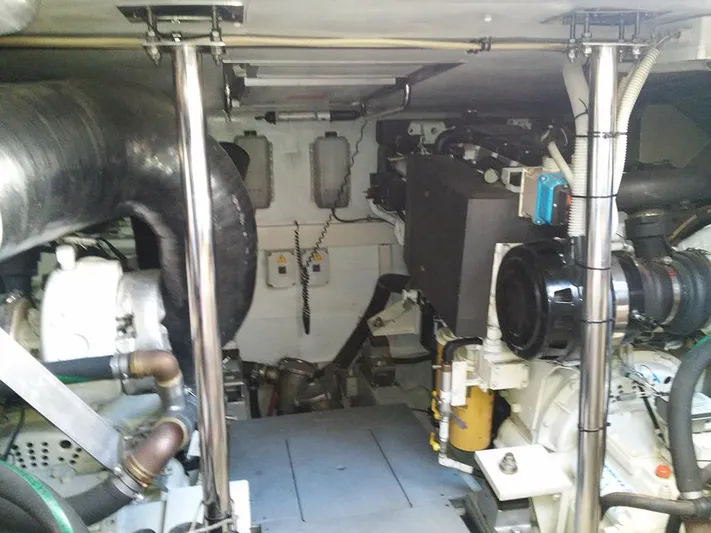 Yacht Photos Pics Engine room of 2009 Azimut 62 Evolution yacht, showcasing mechanical components and piping.