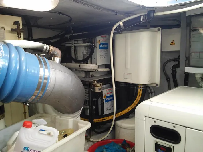  Yacht Photos Pics Engine room of a 2009 Azimut 62 Evolution yacht, featuring mechanical components and storage.