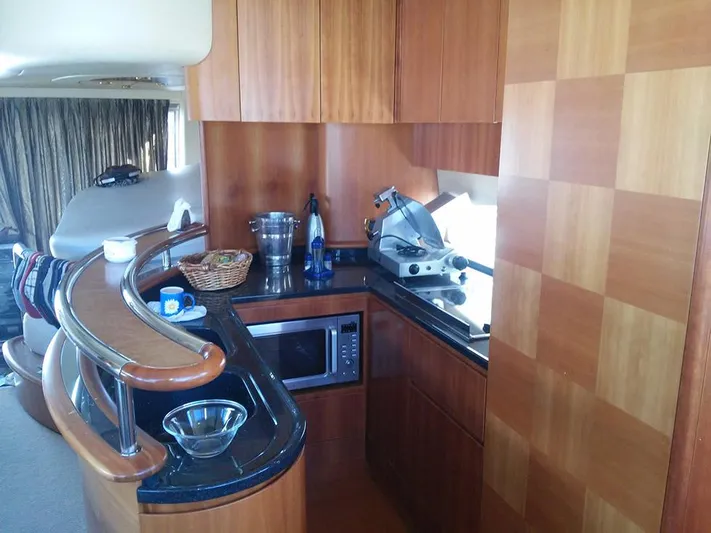  Yacht Photos Pics Luxurious kitchen interior of 2009 Azimut 62 Evolution yacht with modern amenities.
