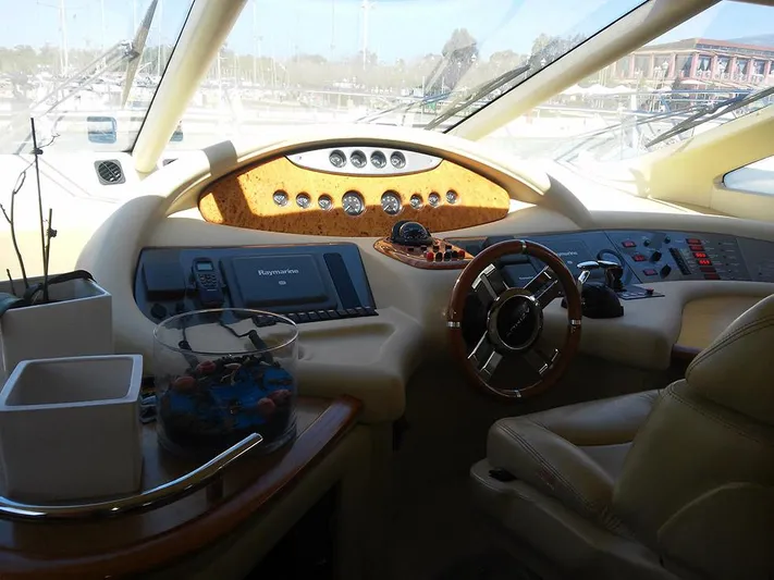  Yacht Photos Pics 2009 Azimut 62 Evolution yacht cockpit with luxurious steering and navigation controls.