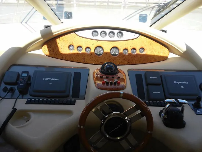  Yacht Photos Pics Helm of 2009 Azimut 62 Evolution yacht with navigation equipment and steering wheel.