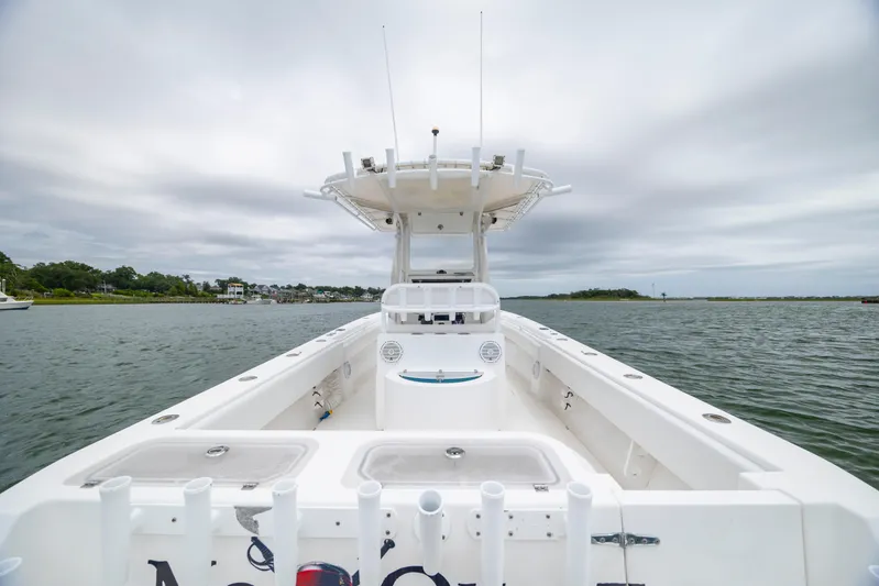  Yacht Photos Pics 2012 Contender 30 Tournament boat on calm waters under cloudy skies.