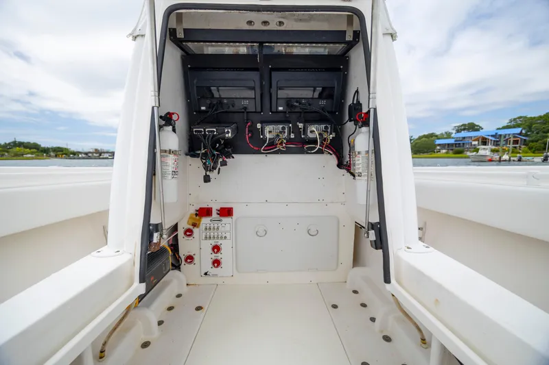  Yacht Photos Pics 2012 Contender 30 Tournament boat console with electronic equipment and wiring.