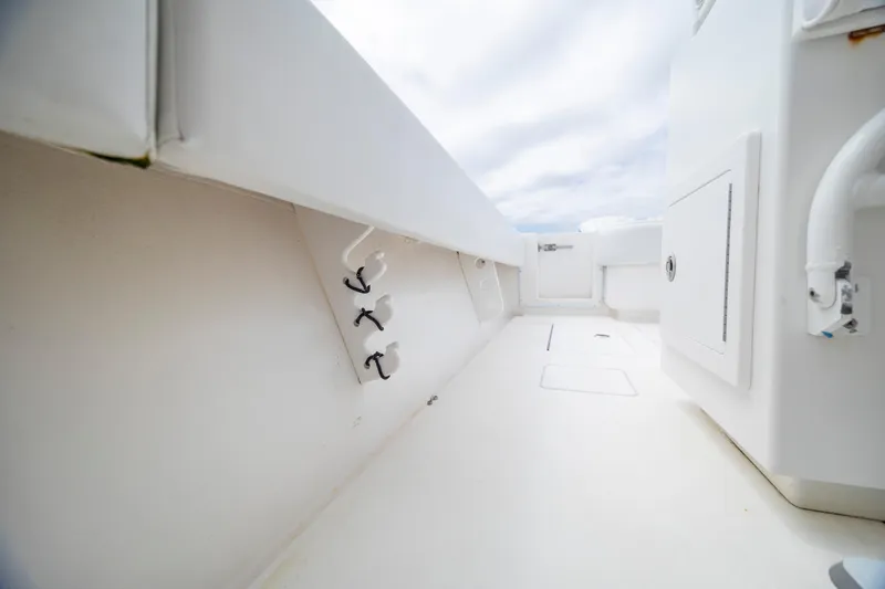  Yacht Photos Pics 2012 Contender 30 Tournament boat interior with storage compartments and rod holders.