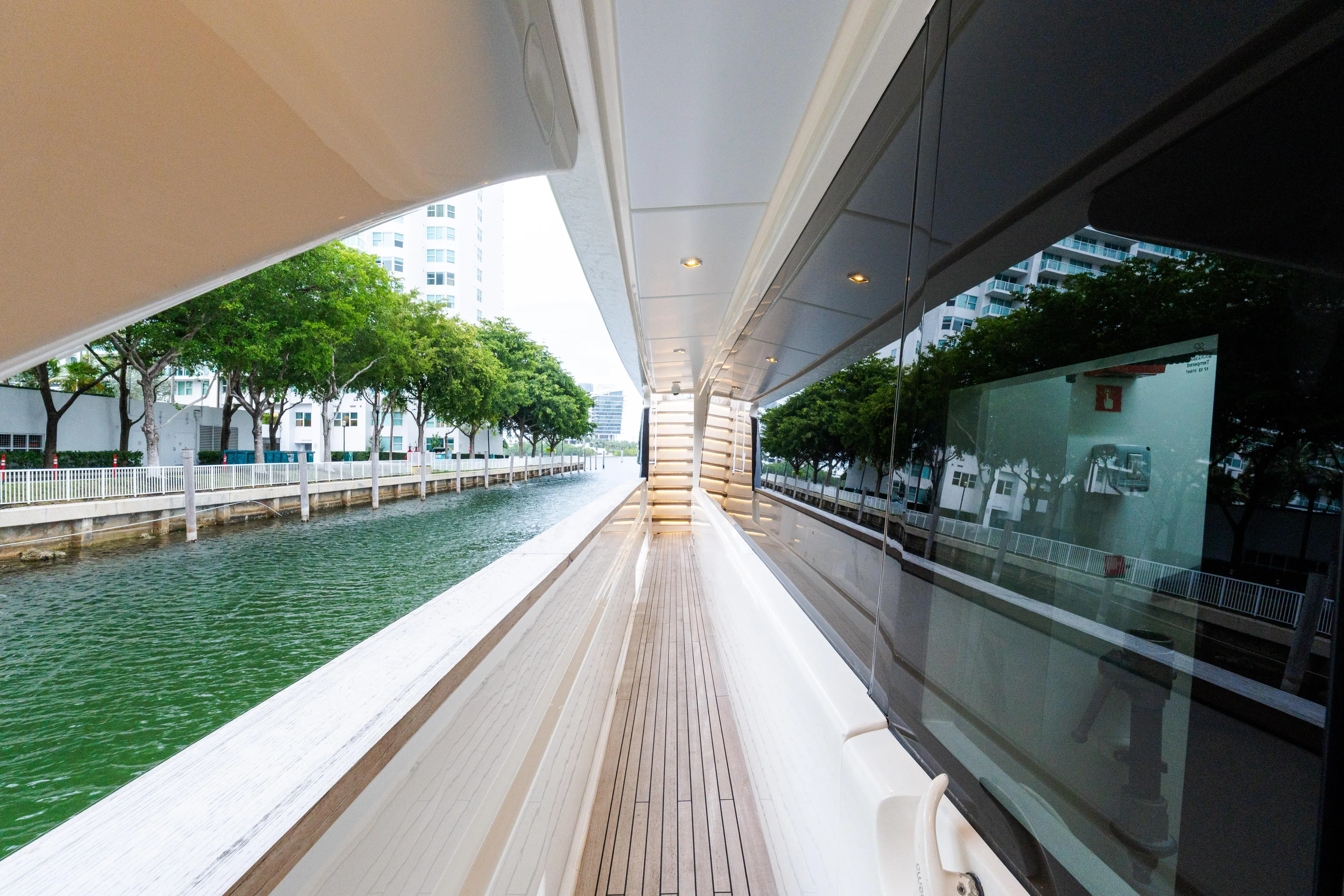 Amity Yacht Photos Pics Custom Line Navetta 33 yacht deck, 2018 model, with waterfront view and modern design.