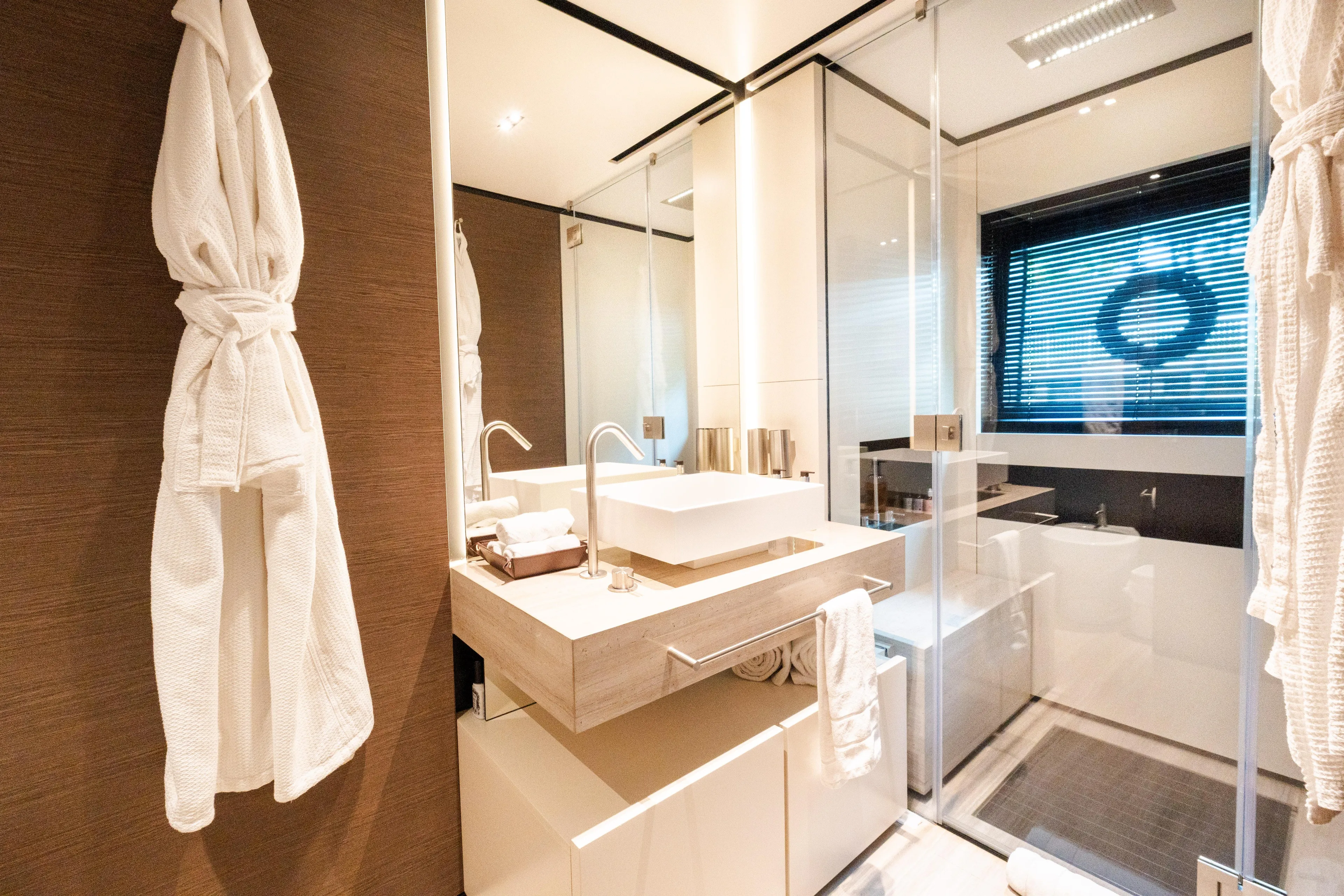 Amity Yacht Photos Pics Luxurious bathroom in 2018 Custom Line Navetta 33 yacht, featuring modern fixtures and elegant design.