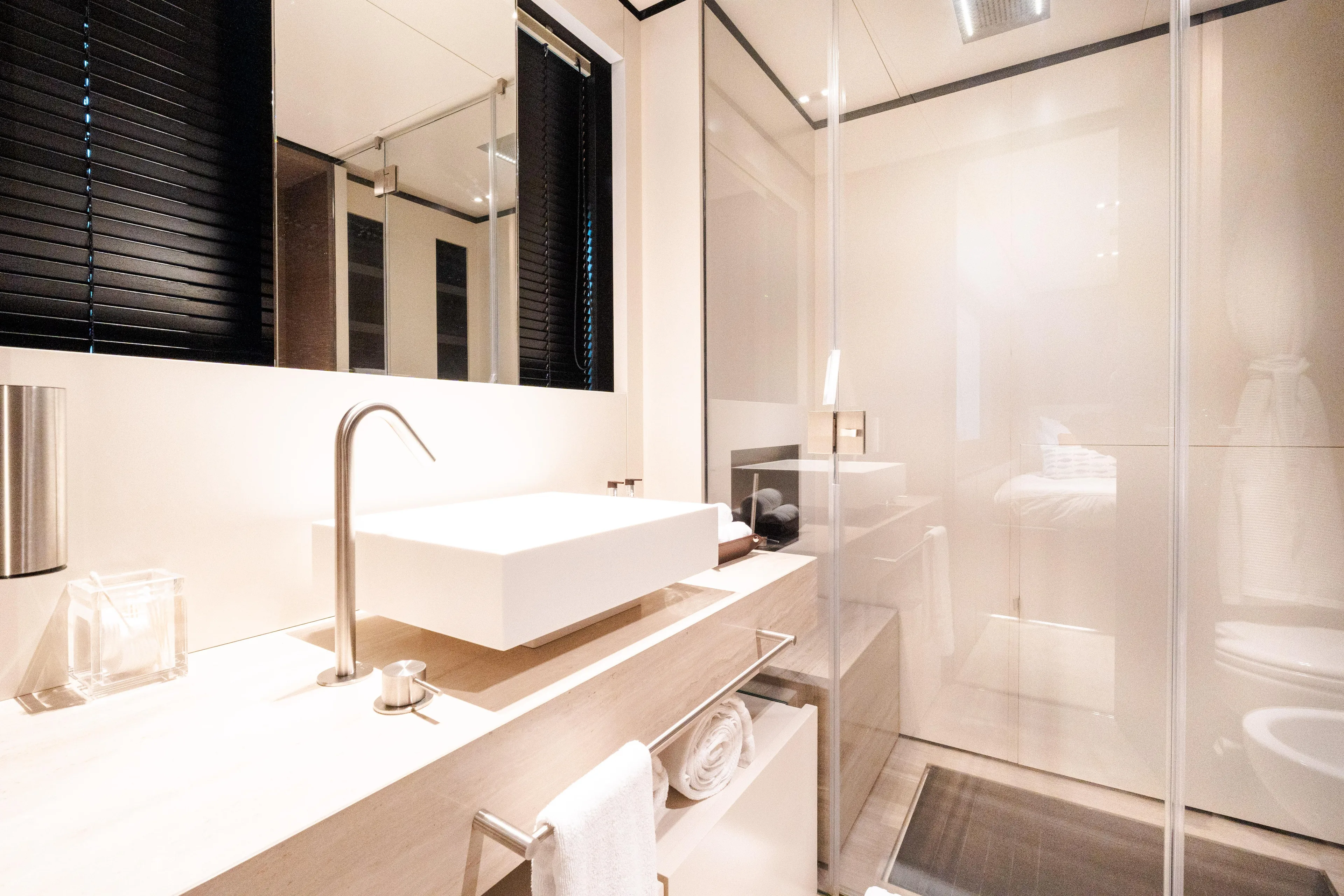 Amity Yacht Photos Pics Luxurious bathroom in 2018 Custom Line Navetta 33 yacht, featuring modern sink and glass shower.