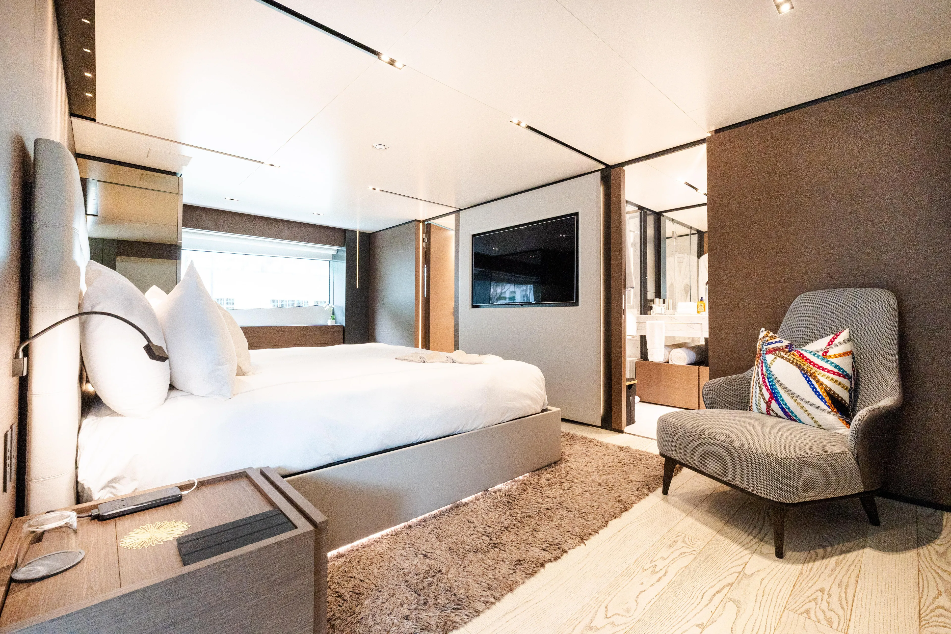 Amity Yacht Photos Pics Luxurious bedroom interior on 2018 Custom Line Navetta 33 yacht, featuring modern design and elegant furnishings.