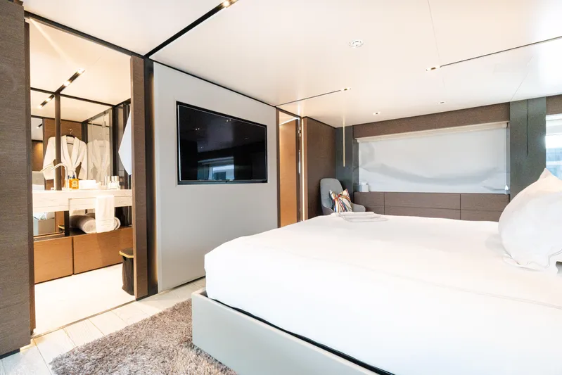 Amity Yacht Photos Pics Luxurious bedroom interior on 2018 Custom Line Navetta 33 yacht, featuring modern design and amenities.
