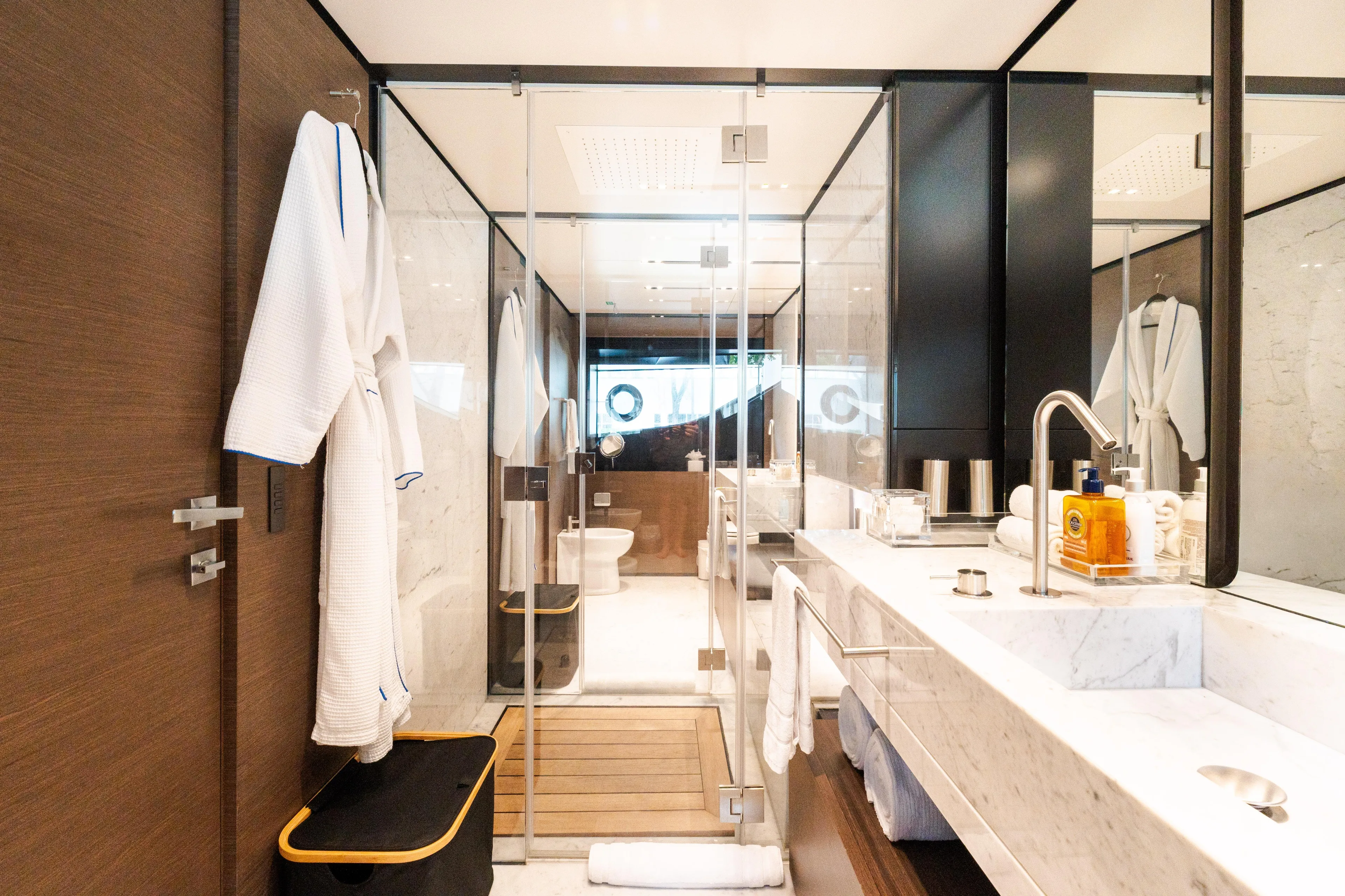 Amity Yacht Photos Pics Luxurious bathroom on 2018 Custom Line Navetta 33 yacht, featuring elegant marble and modern fixtures.