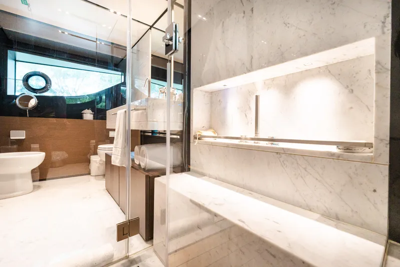 Amity Yacht Photos Pics Luxurious marble bathroom on 2018 Custom Line Navetta 33 yacht, featuring modern fixtures and elegant design.