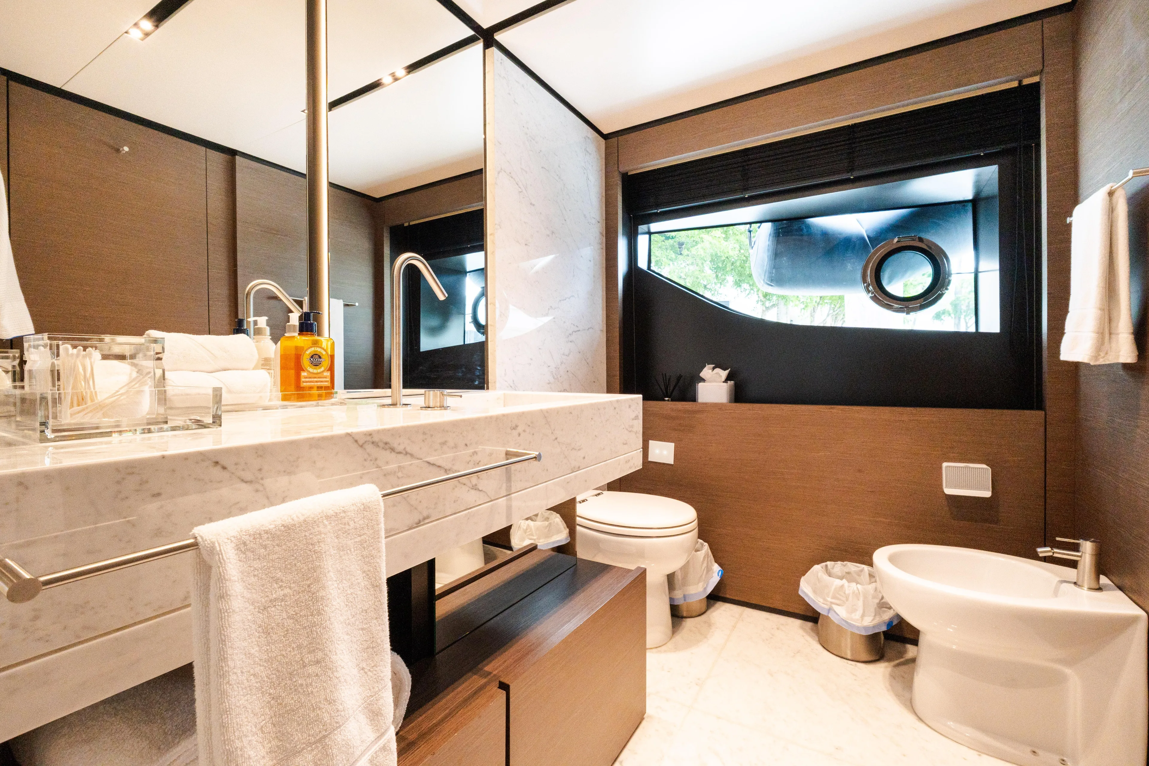 Amity Yacht Photos Pics Luxurious bathroom on 2018 Custom Line Navetta 33 yacht, featuring marble sink and modern fixtures.