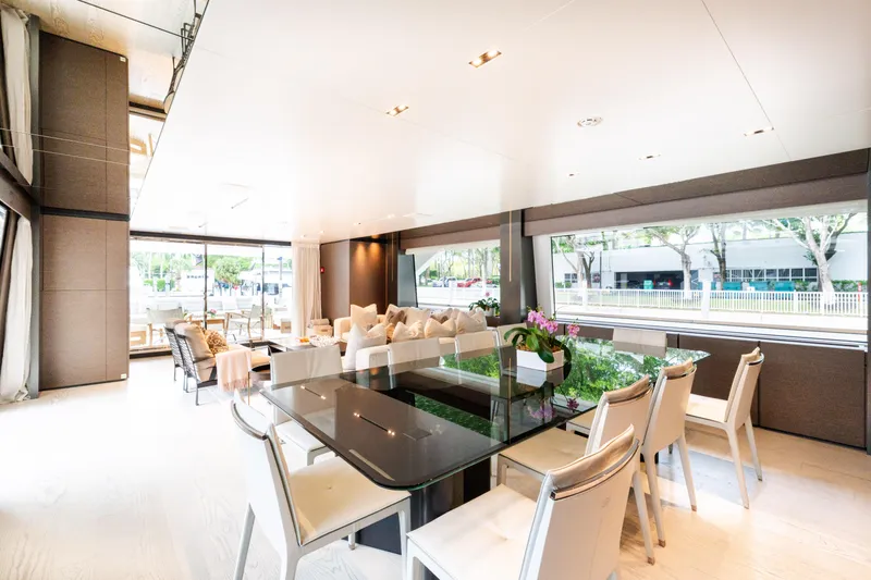 Amity Yacht Photos Pics Luxurious interior of 2018 Custom Line Navetta 33 yacht with elegant dining area and large windows.