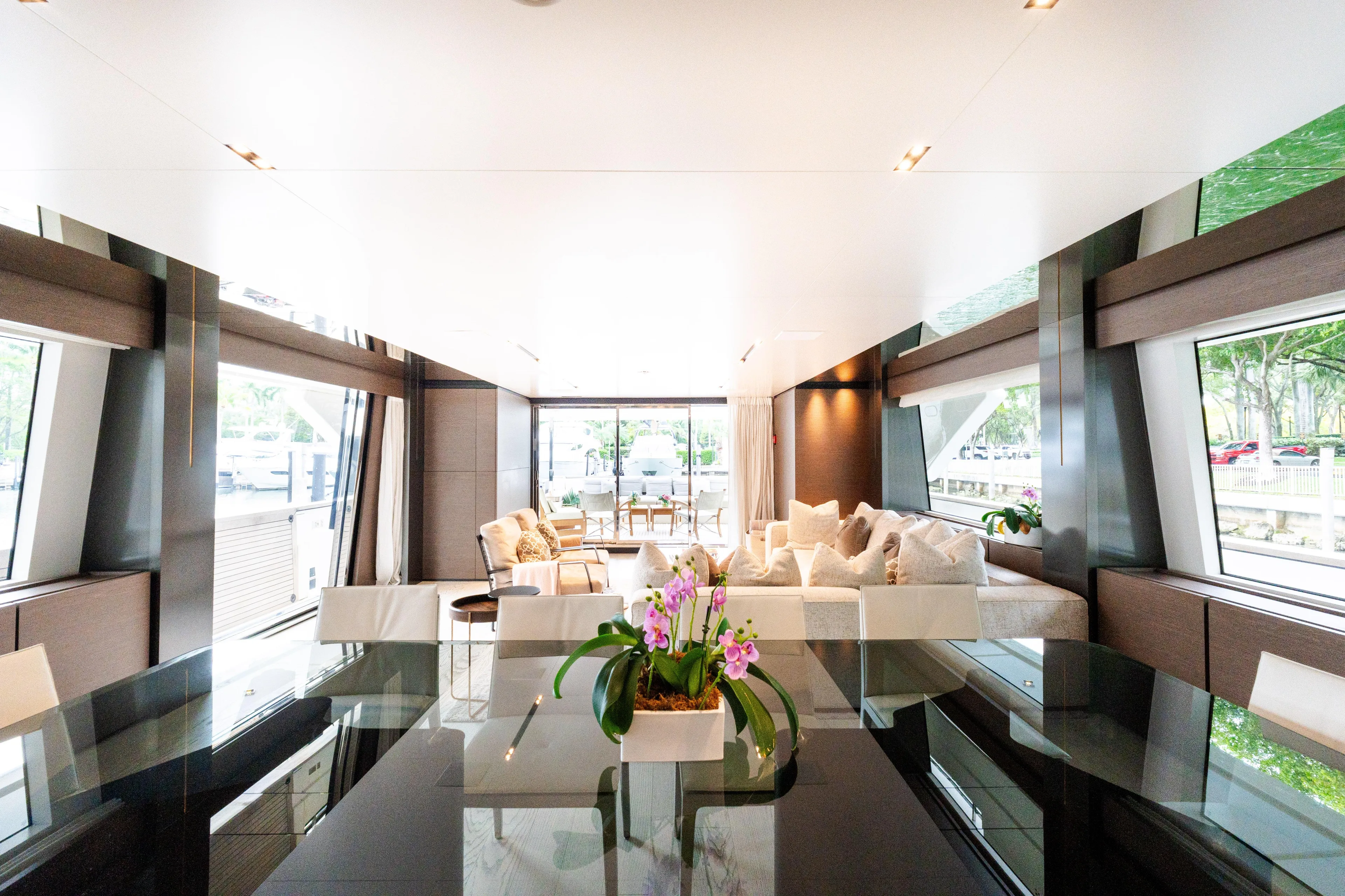 Amity Yacht Photos Pics Luxurious interior of 2018 Custom Line Navetta 33 yacht with elegant seating and floral decor.
