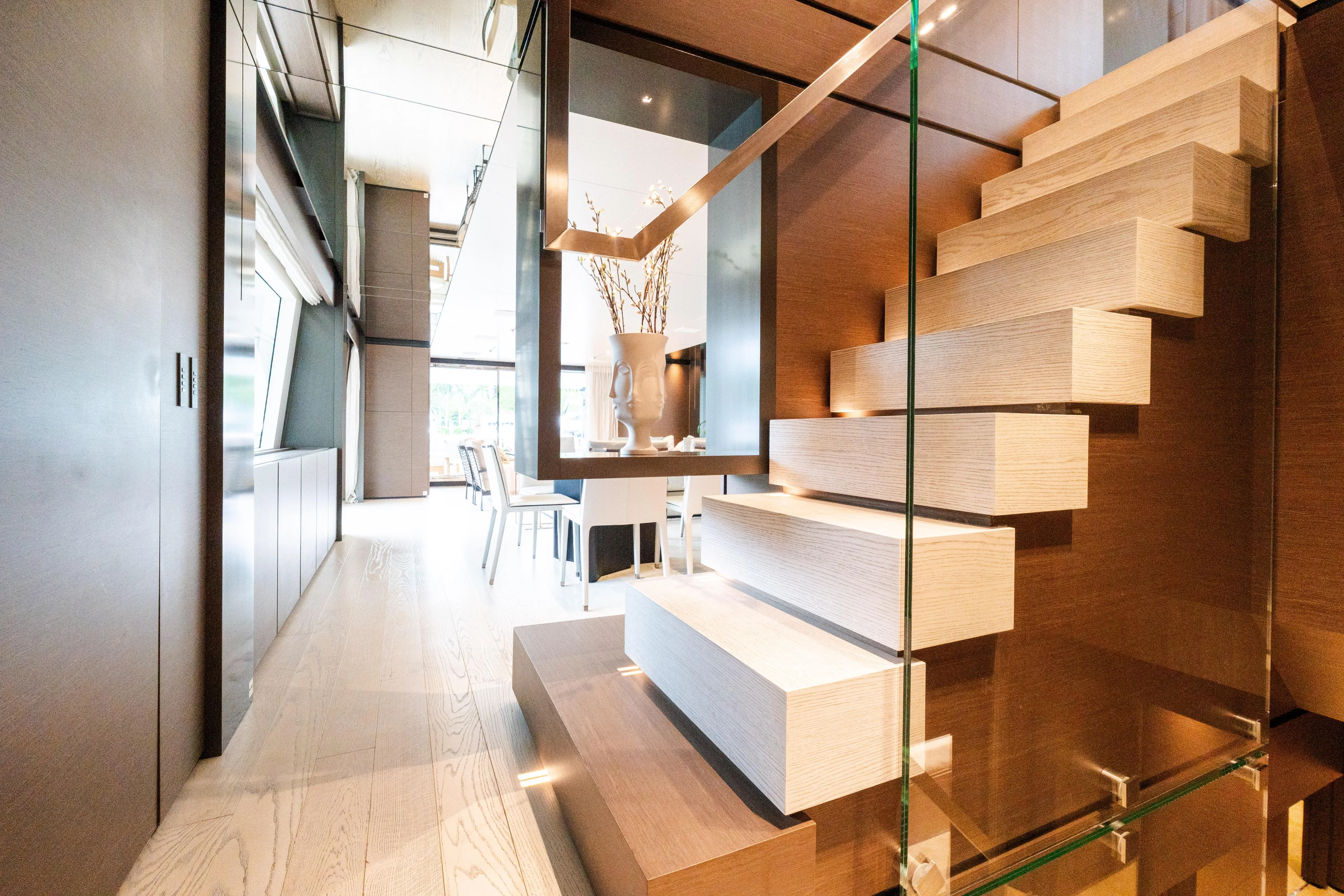 Amity Yacht Photos Pics Luxurious interior of 2018 Custom Line Navetta 33 yacht with modern staircase design.