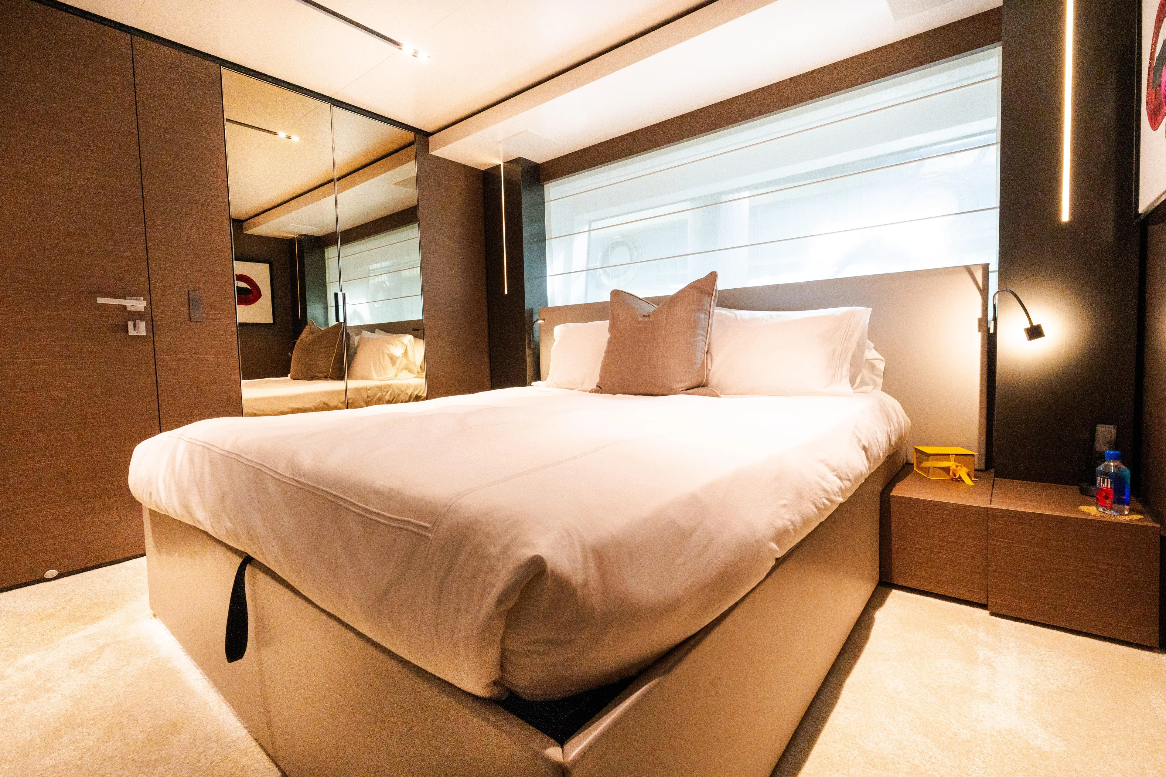 Amity Yacht Photos Pics Luxurious bedroom interior on 2018 Custom Line Navetta 33 yacht, featuring modern design and cozy ambiance.
