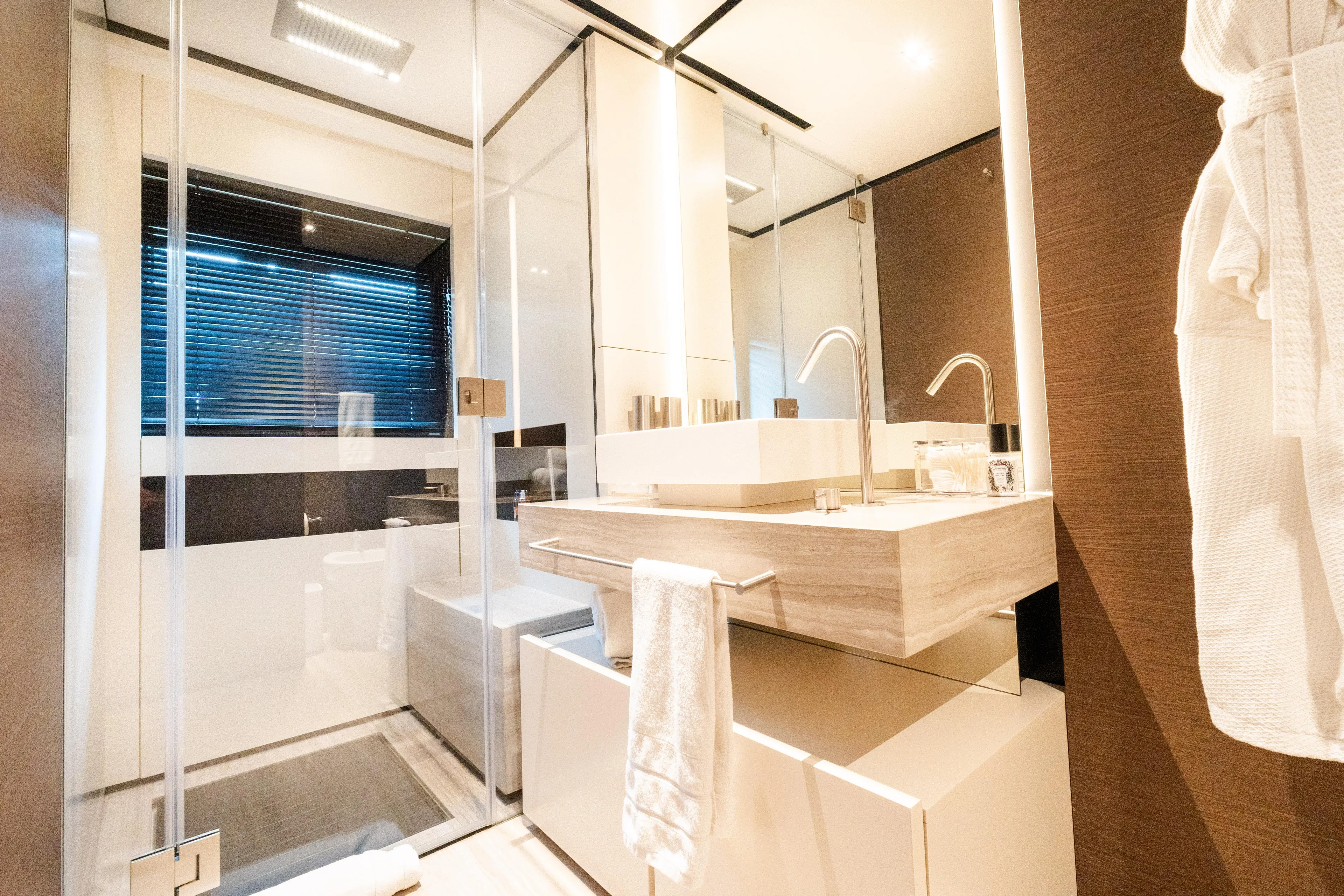 Amity Yacht Photos Pics Luxurious bathroom in 2018 Custom Line Navetta 33 yacht, featuring modern fixtures and elegant design.