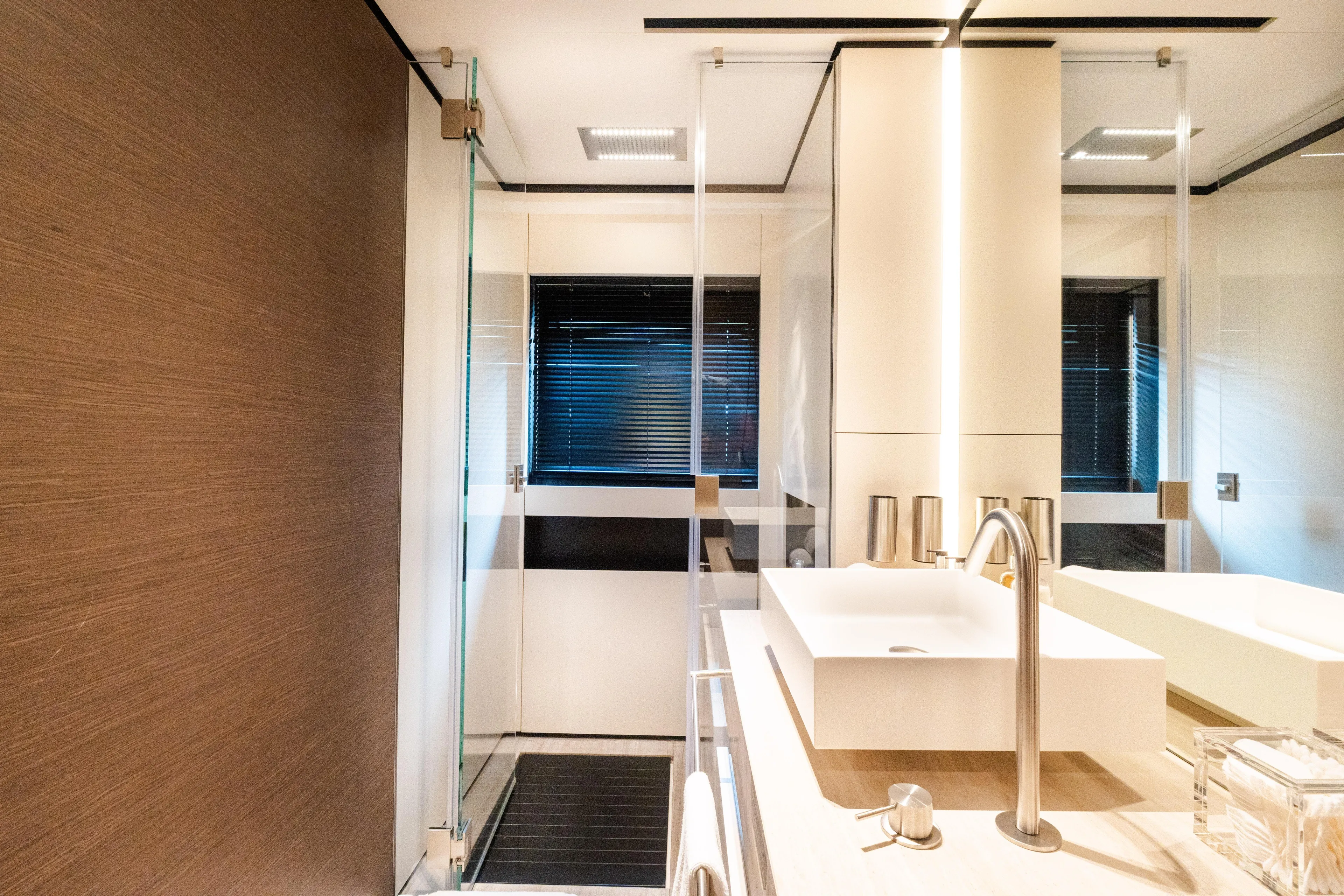 Amity Yacht Photos Pics Luxurious bathroom interior on 2018 Custom Line Navetta 33 yacht, featuring modern fixtures and elegant design.