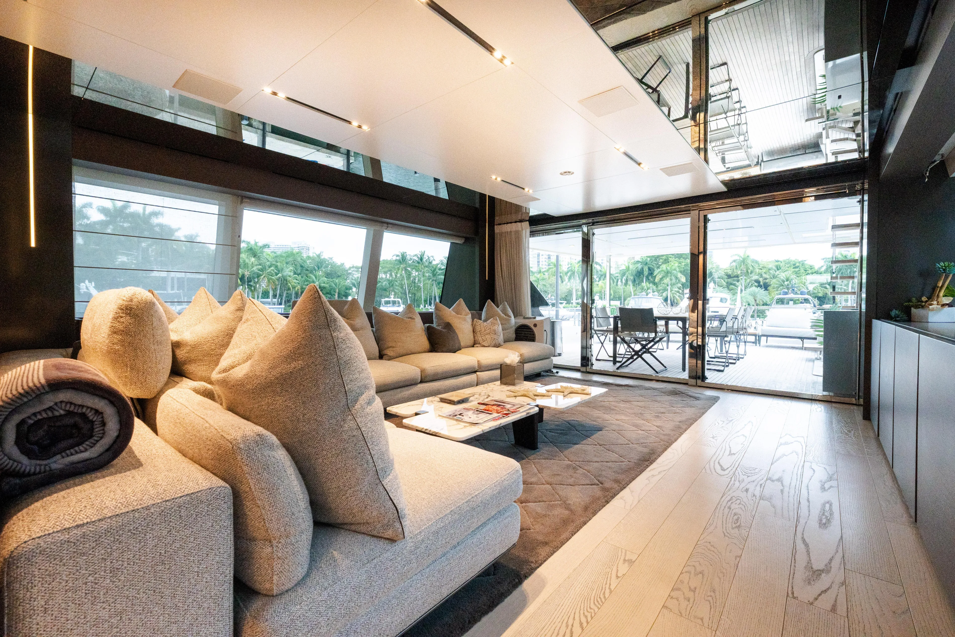 Amity Yacht Photos Pics Luxurious interior of 2018 Custom Line Navetta 33 yacht with plush seating and modern decor.