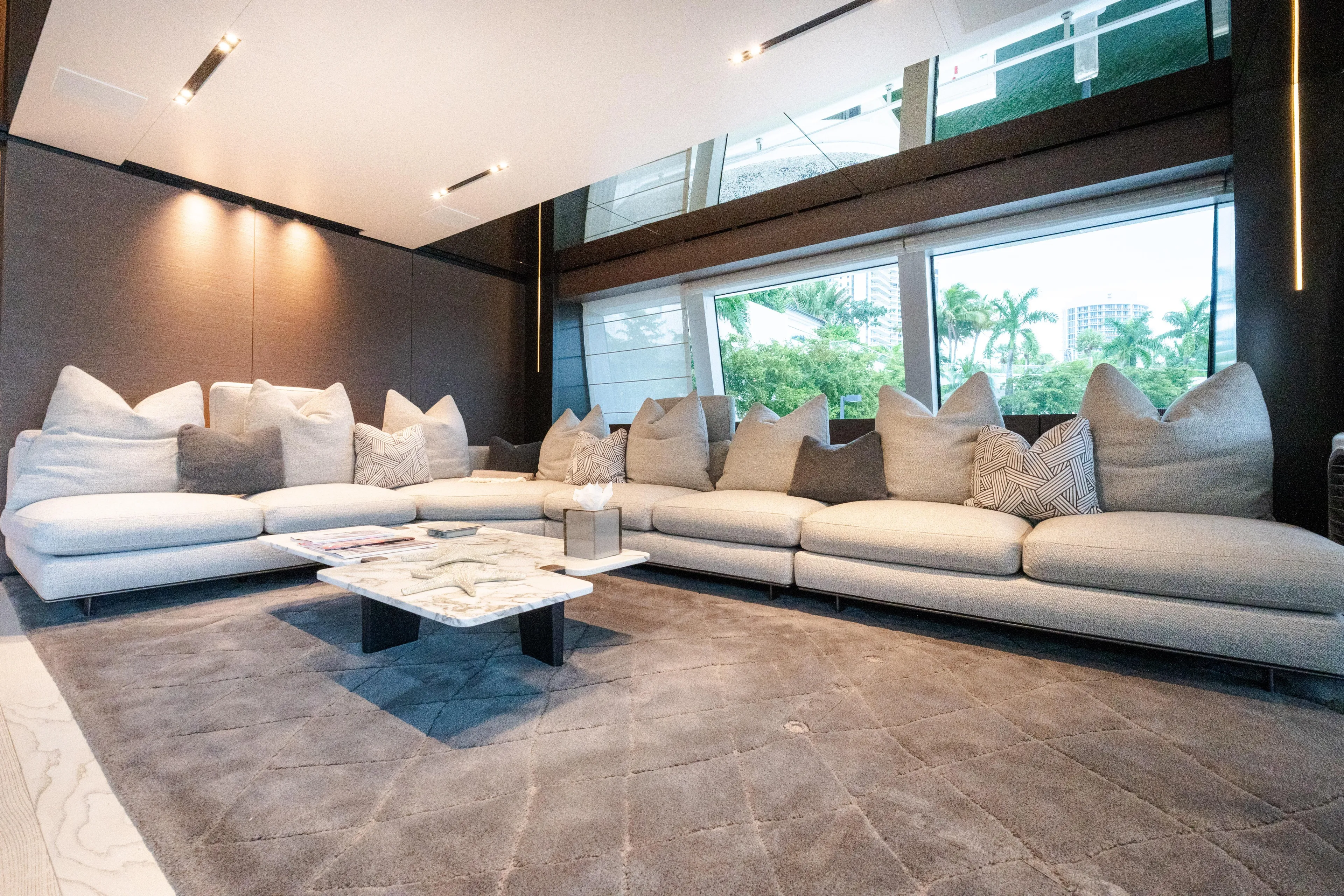 Amity Yacht Photos Pics Luxurious interior of 2018 Custom Line Navetta 33 yacht with plush seating and modern decor.