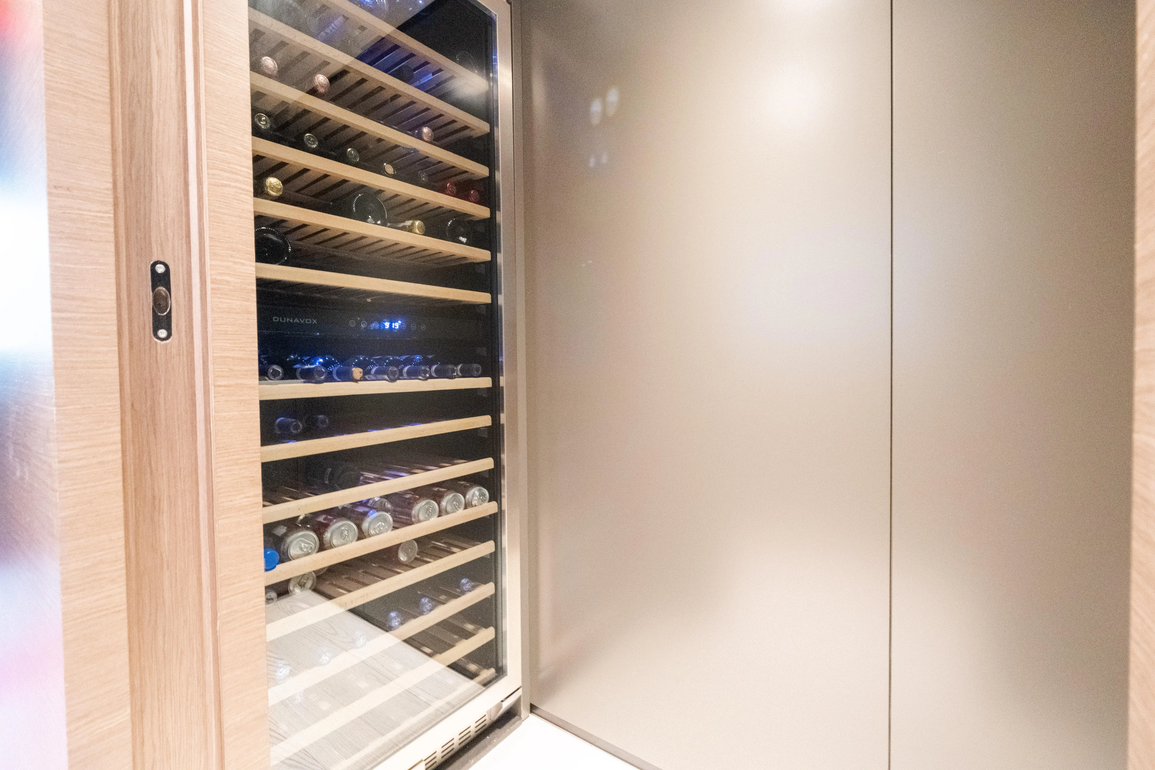 Amity Yacht Photos Pics Wine cooler with wooden shelves on Custom Line Navetta 33 yacht, 2018 model.