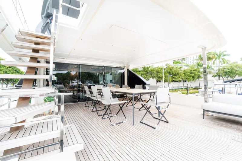 Amity Yacht Photos Pics Luxurious outdoor deck of 2018 Custom Line Navetta 33 yacht with seating and stairs.