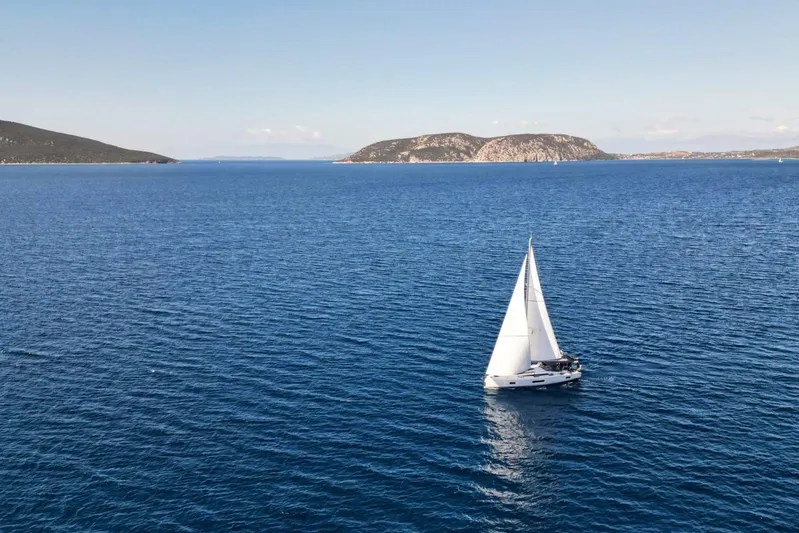  Yacht Photos Pics Sailing yacht Beneteau Oceanis 51.1, 2023 model, gliding on serene blue waters.